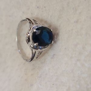 Size 8 blue and silver ring.